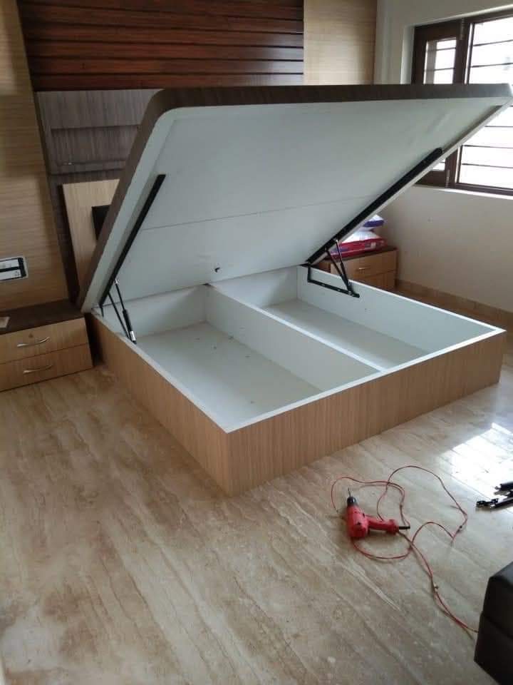 Hydraulic storage bed lifted open to show the storage space beneath